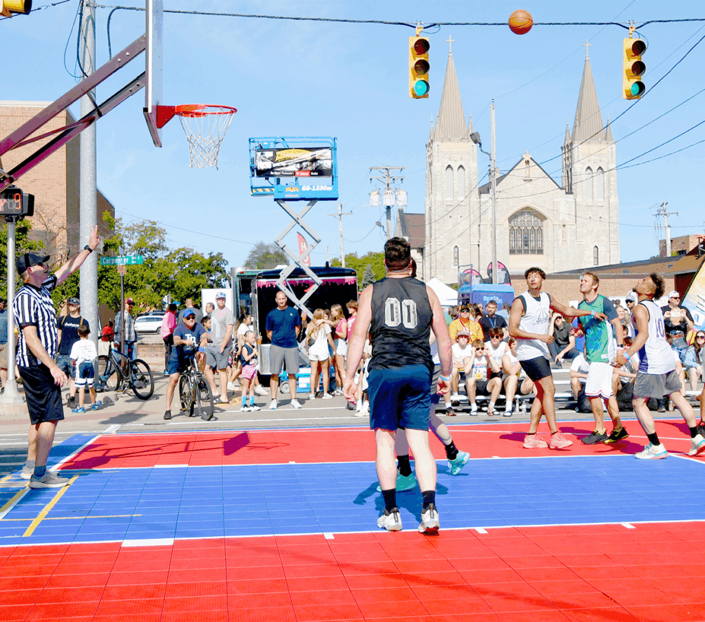 Outdoor basketball match with spectators