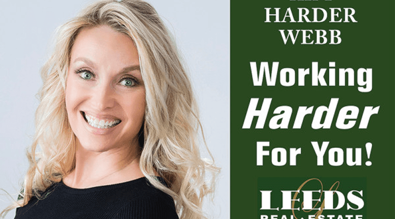 Real estate advertisement with smiling woman