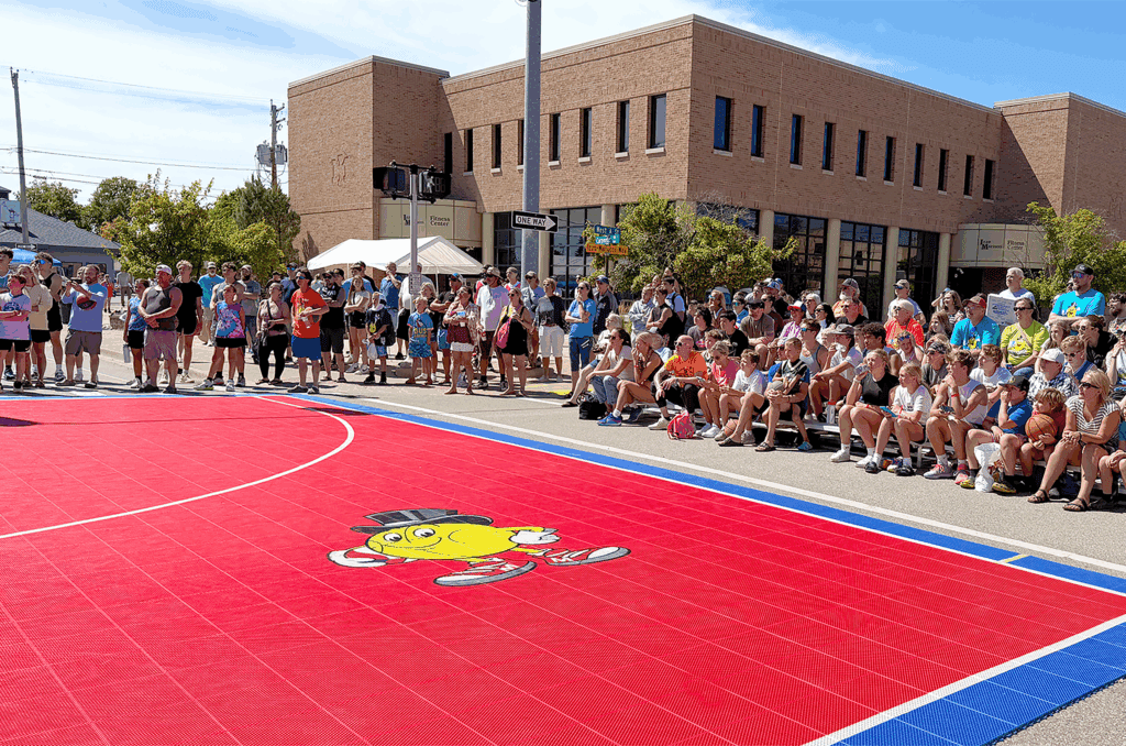 Spectators enjoy sunny day at street game