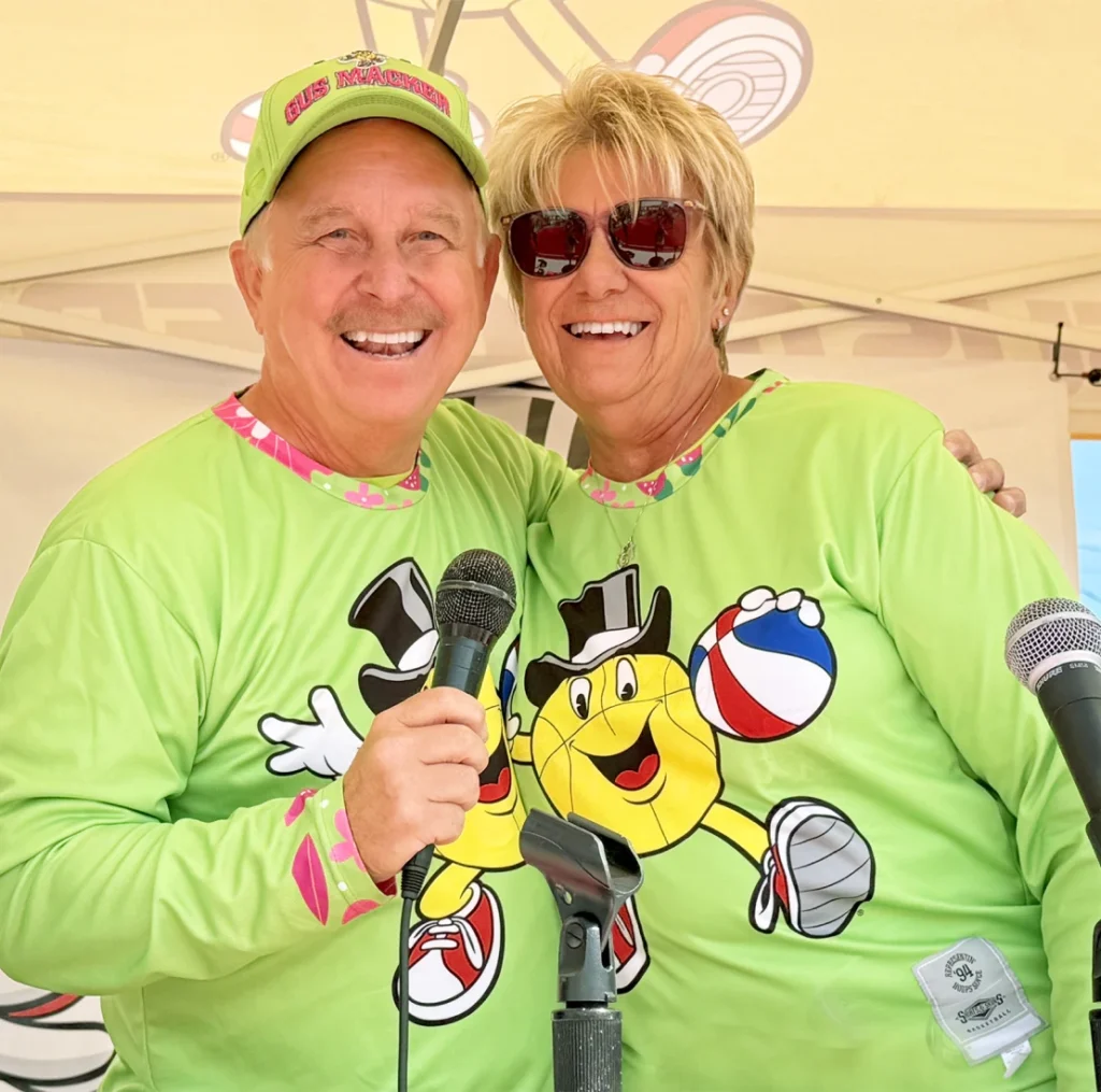 Smiling couple in matching green shirts