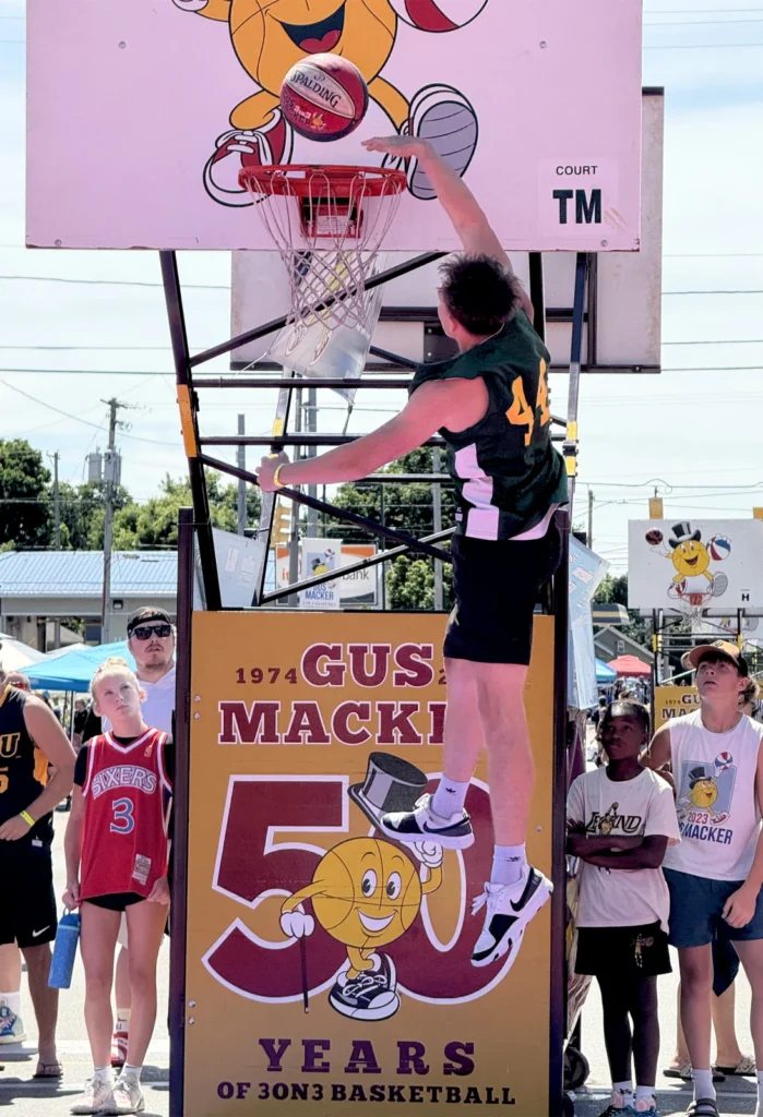 Basketball player dunking at Gus Macker event